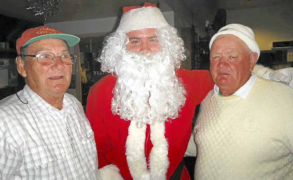 Merv Brand, Santa and Perry Pyke celebrate Christmas in July at Gympie Pines on Saturday. Merv Brand, Santa and Perry Pyke celebrate Christmas in July at Gympie Pines on Saturday.